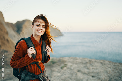 happy woman in nature by the sea