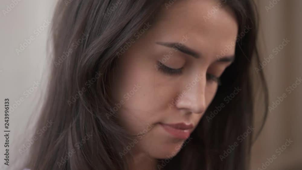 A close-up view of the pretty young caucasian girl. She is thinking about her fate and life choices. She is worried and not sure what to do. A close-up view of the pretty young caucasian girl. She is thinking about her fate and life choices. She is worried and not sure what to do.
