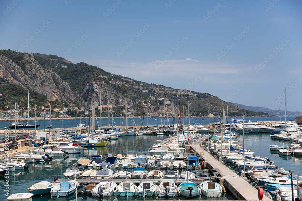 Menton France July 9th 2015 : Yachts and small sailing boats moored in Menton harbour on a beautifulsummer day