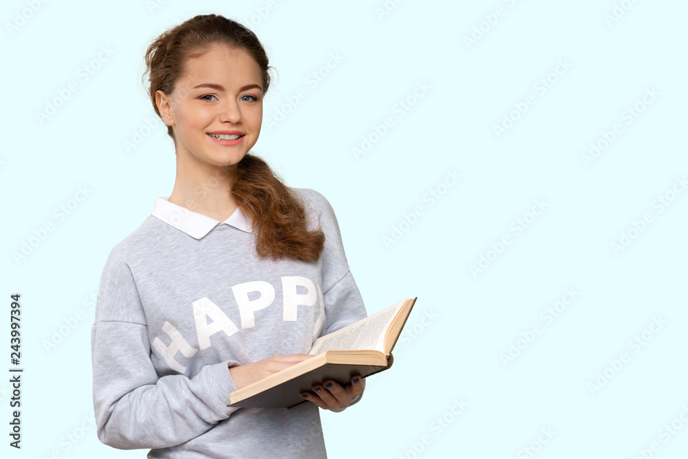Beautiful young woman holding book Beautiful young woman holding book