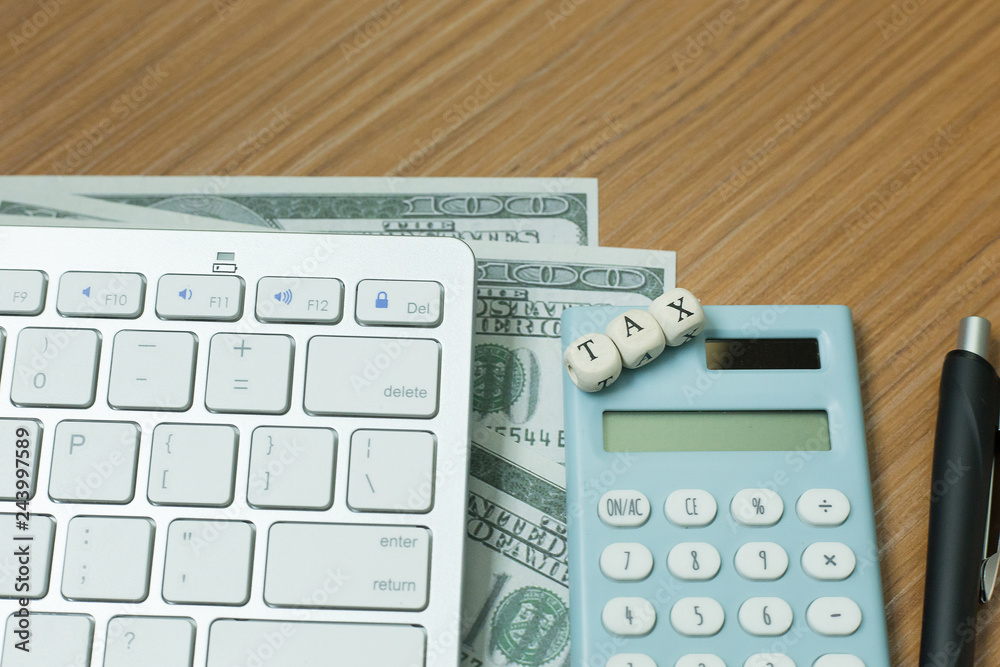 Tax wooden cubic on work table for business content. Tax wooden cubic on work table for business content.