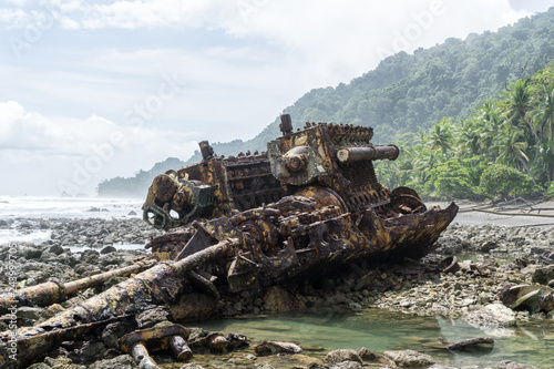 Rusted Engine from Shipwreck on Beach, Corcovado National Park, Costa Rica photo