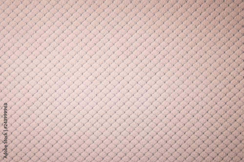 Fototapeta premium Textured background surface of textile upholstery furniture close-up. burlap beige color fabric structure
