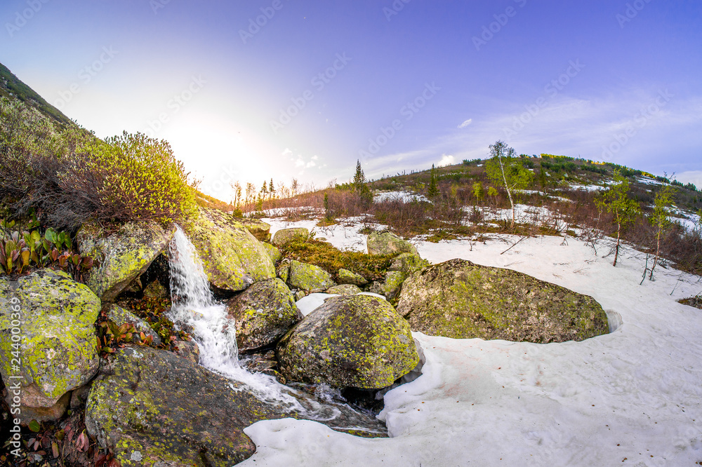 Sunriase at Davsha river source - a stream coming out of stones and snow at sunrise fisheye Sunriase at Davsha river source - a stream coming out of stones and snow at sunrise fisheye