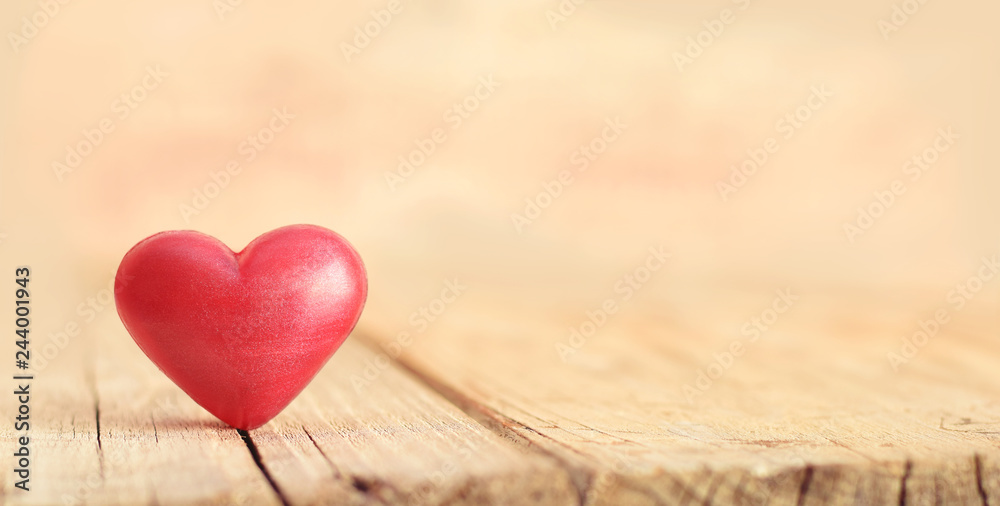 Red heart on splitted wooden desk Red heart on splitted wooden desk