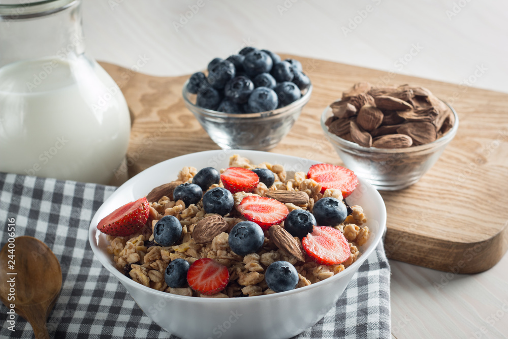 Healthy breakfast concept with oat flakes and fresh berries on rustic background. Food made of granola and muesli. Healthy banana smoothie with blackberries, honey and milk. Healthy breakfast concept with oat flakes and fresh berries on rustic background. Food made of granola and muesli. Healthy banana smoothie with blackberries, honey and milk.