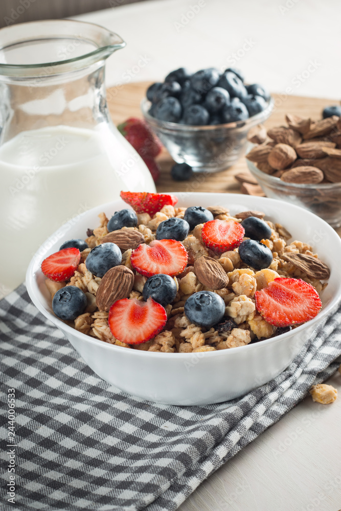 Healthy breakfast concept with oat flakes and fresh berries on rustic background. Food made of granola and muesli. Healthy banana smoothie with blackberries, honey and milk. Healthy breakfast concept with oat flakes and fresh berries on rustic background. Food made of granola and muesli. Healthy banana smoothie with blackberries, honey and milk.