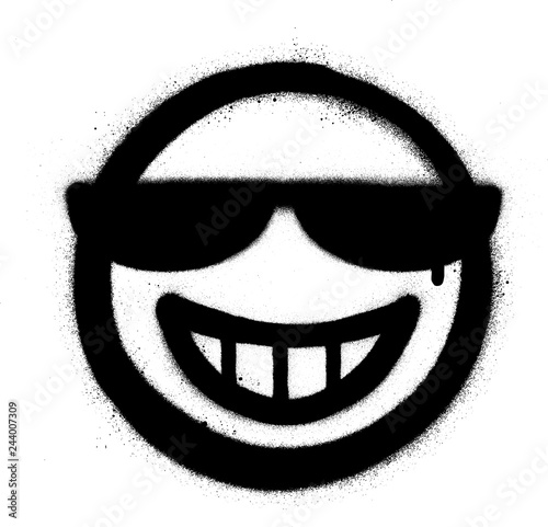 graffiti grin icon with sunglasses sprayed in black over white