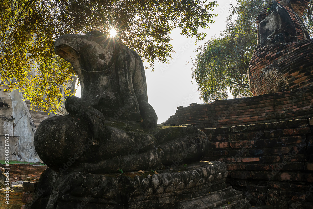 Old Buddha statue no head at