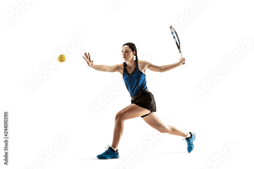 Full length portrait of young woman playing tennis isolated on white background. Healthy lifestyle. The practicing, fitness, sport, exercise concept. The female model in motion or movement © master1305