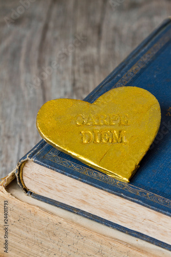 Nostalgic Golden Heart On Old Books photo