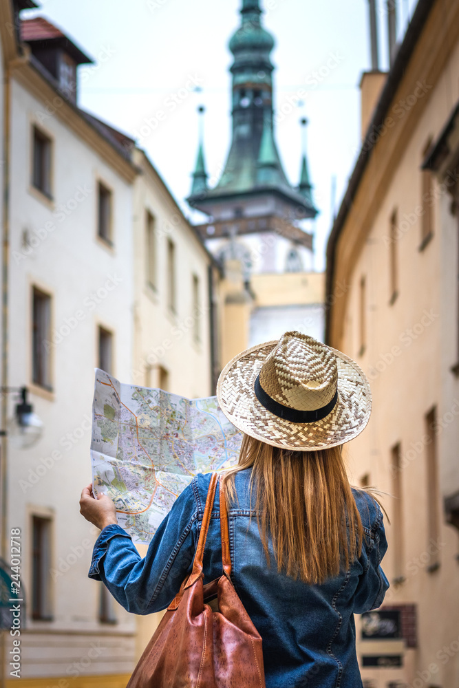 Obraz premium Woman tourist with map on the street. Tourism in Europe. 