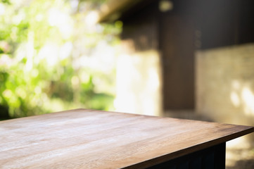 empty wood table with blur montage outdoor garden background