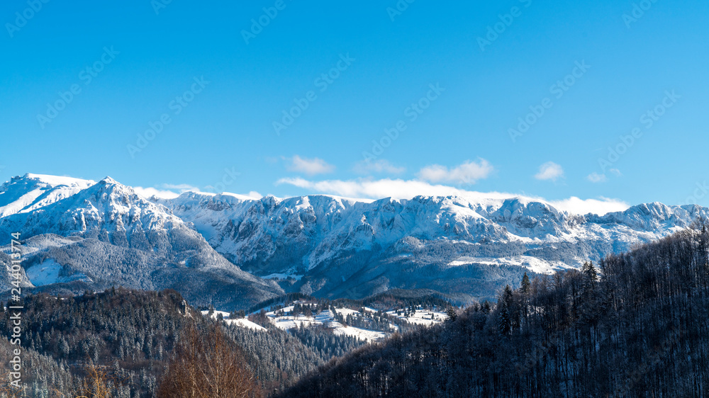 Brasov - Romania, Rucar - Bran snowy picturesque hills on a sunny cold December.