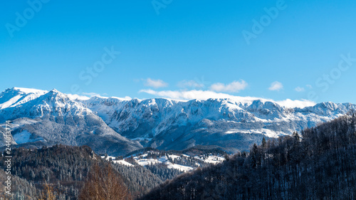 Brasov - Romania  Rucar - Bran snowy picturesque hills on a sunny cold December.