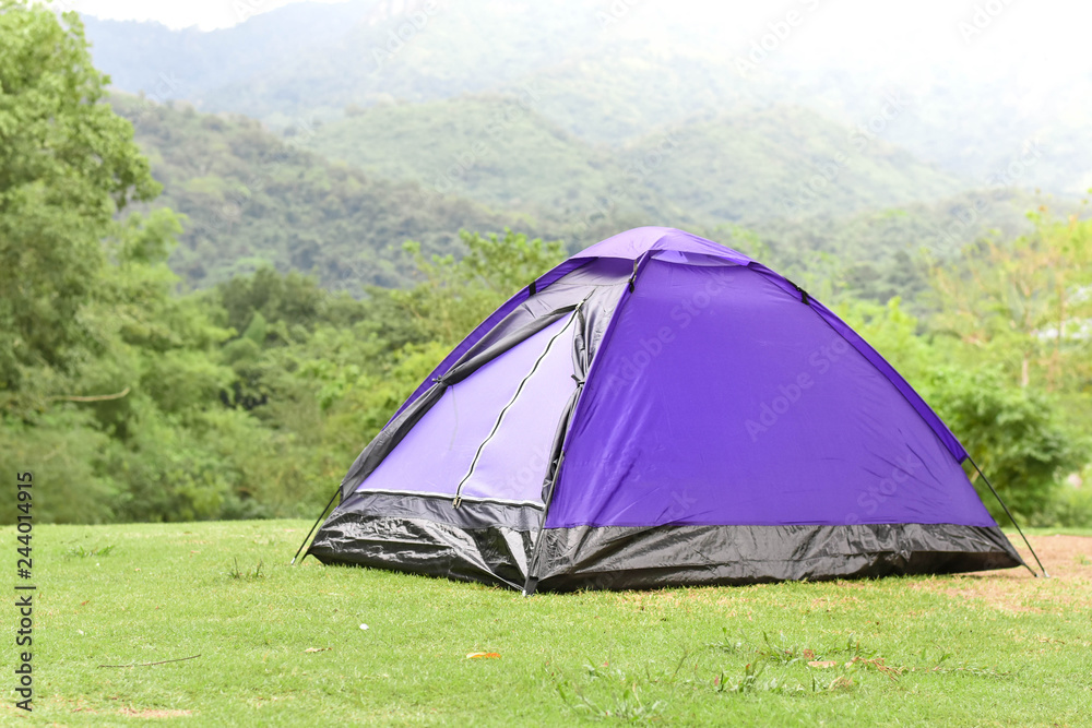 Purple color dome tent in mountain range landscapes.