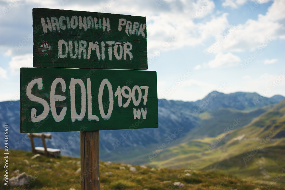 Wooden sign with the inscription "Durmitor National Park, Sedlo, 1907".  Stock Photo | Adobe Stock