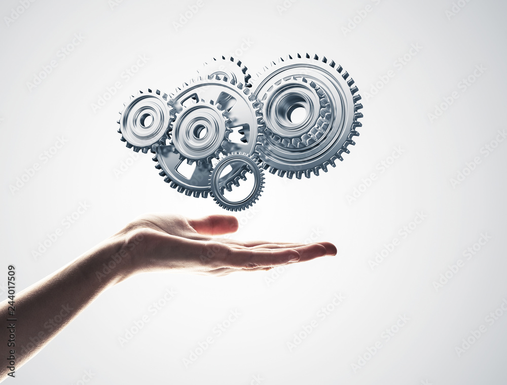 Concept of teamwork and cooperation presented with working gear 