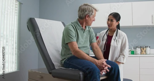 Doctor walking into exam room and greeting patient