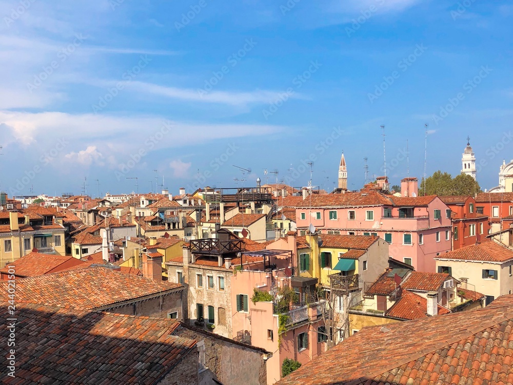 Tiled roofs of venice, Italy and blue sky above. Architecture. Copy space