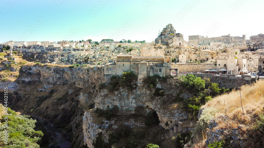 Foreshortening of white houses on the overhanging of Matera city