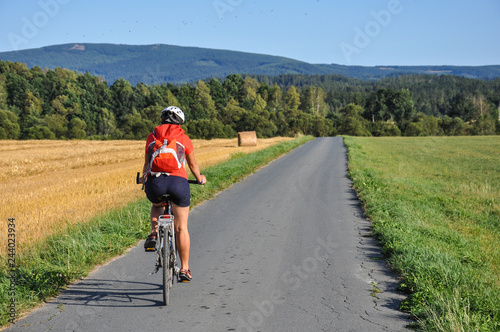 Karkonosze - woman on bike, cyclist, biker in the mountains, cycling in the landscape