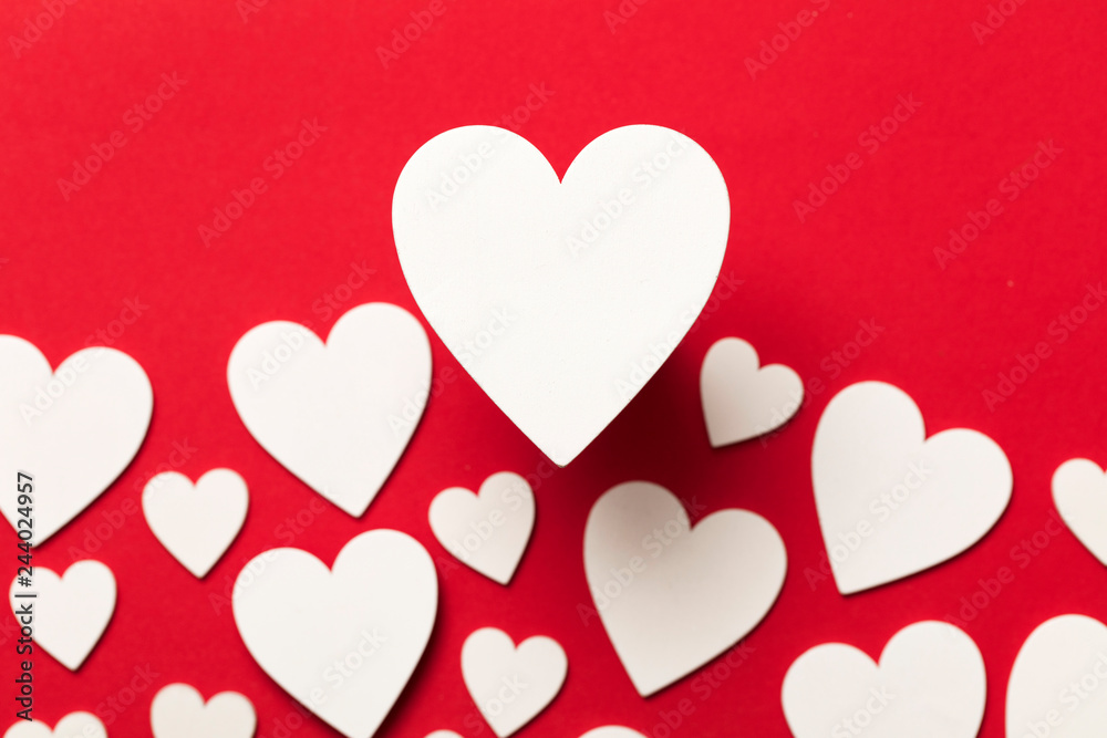 White valentine love hearts on a red background