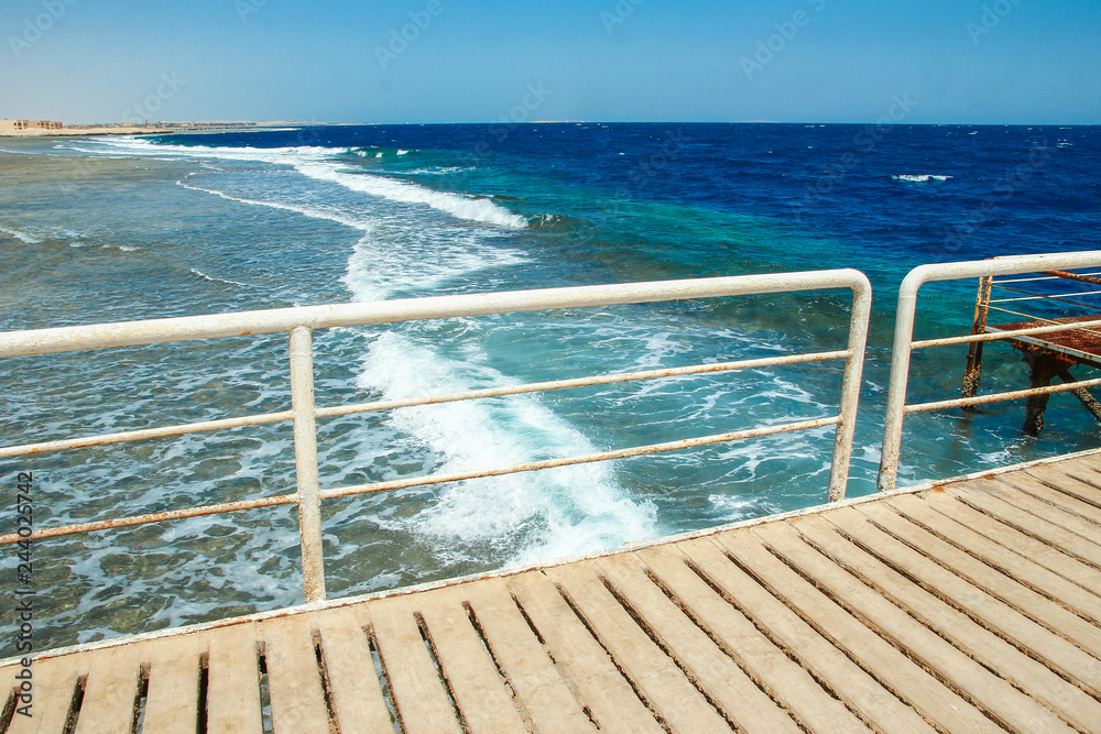 Stylish beautiful pier on the sea for ships background