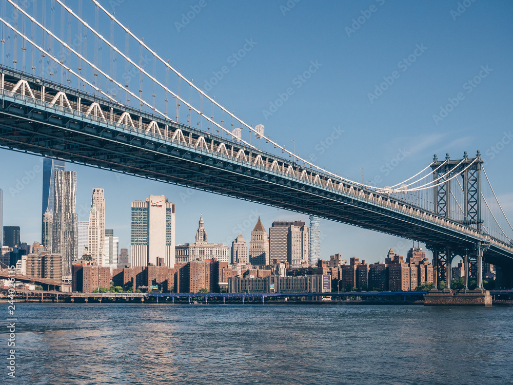 View of the Manhattan Bridge on a summer day View of the Manhattan Bridge on a summer day
