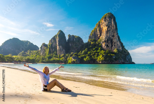 Woman resting on amazing Railay beach in Krabi Thailand. Tropical resort.