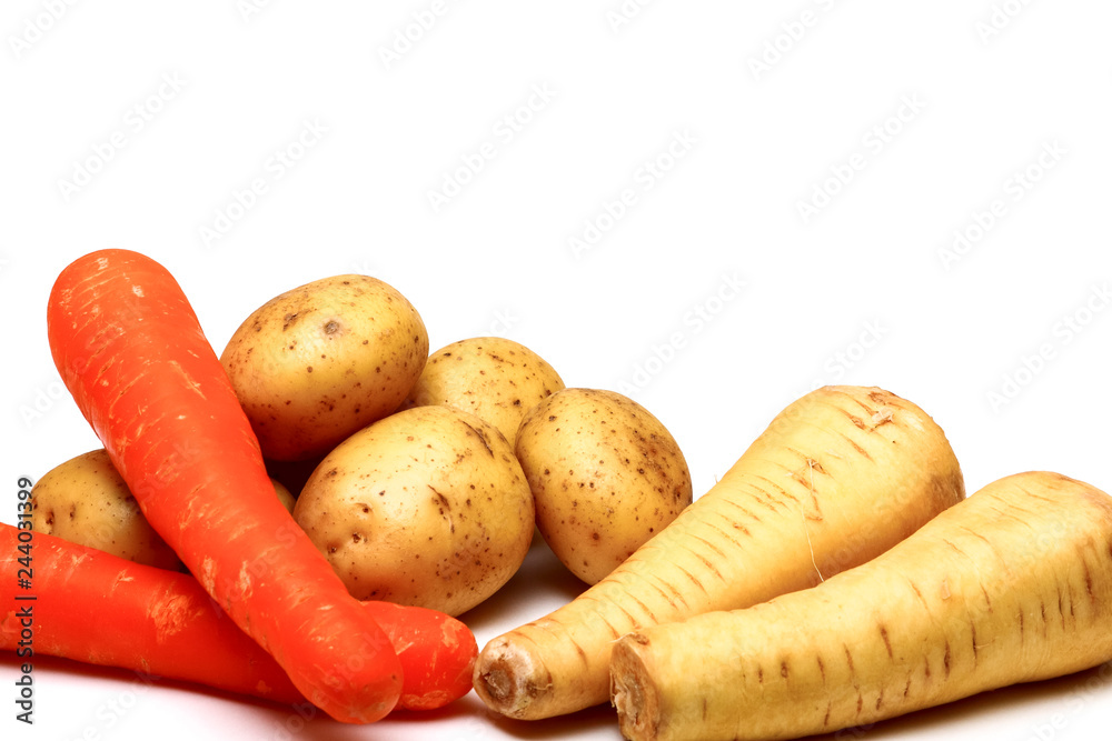 Raw potatoes,carrots and parsnips isolated on a white background Raw potatoes,carrots and parsnips isolated on a white background