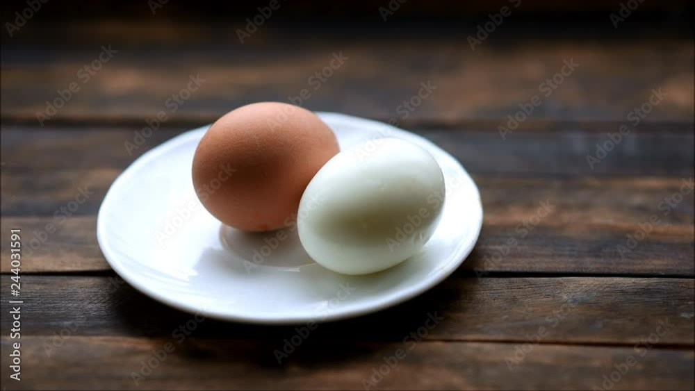 boiled chicken eggs on a plate on a wooden table boiled chicken eggs on a plate on a wooden table