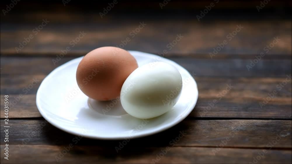 boiled chicken eggs on a plate on a wooden table boiled chicken eggs on a plate on a wooden table