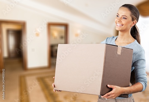 Attractive young woman with box, delivery concept