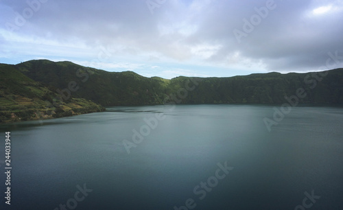 Aerial View from a beautiful lagoon surrounded by mountains. Ancient volcano crater. Seven Cities lagoon Azores Islands Portugal