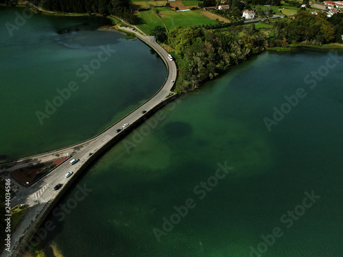Aerial view from a bridge surrounded by a lake . Azores Portugal. Drone shot