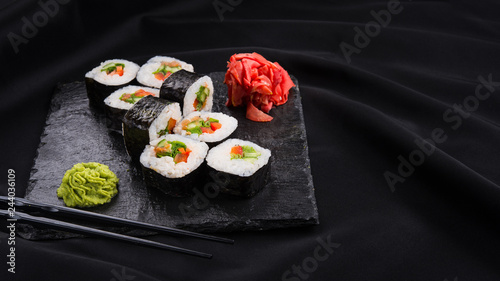 Sushi roll with wasabi and ginger