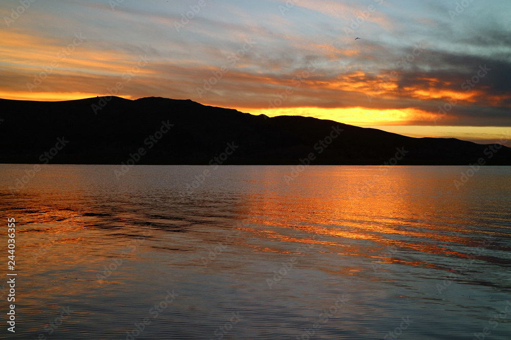 Impressive Sunset Afterglow Reflecting on the Famous Lake Titicaca in Puno, Peru, South America