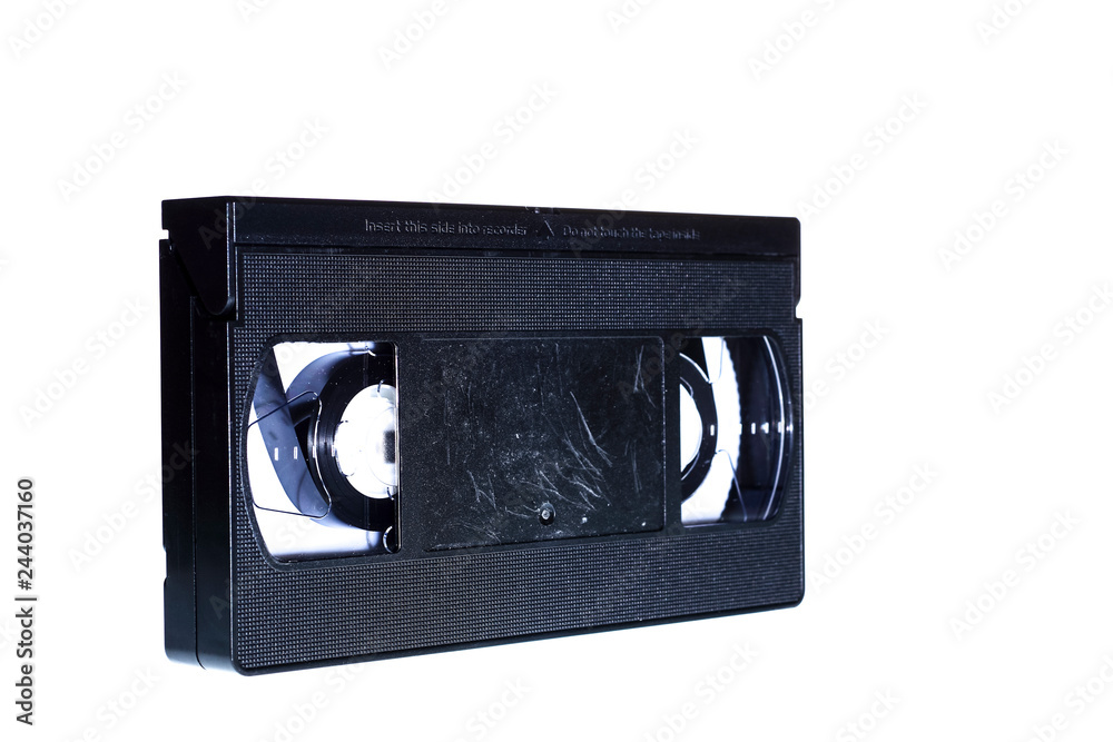 Old obsolete video cassette tape isolated on a white background