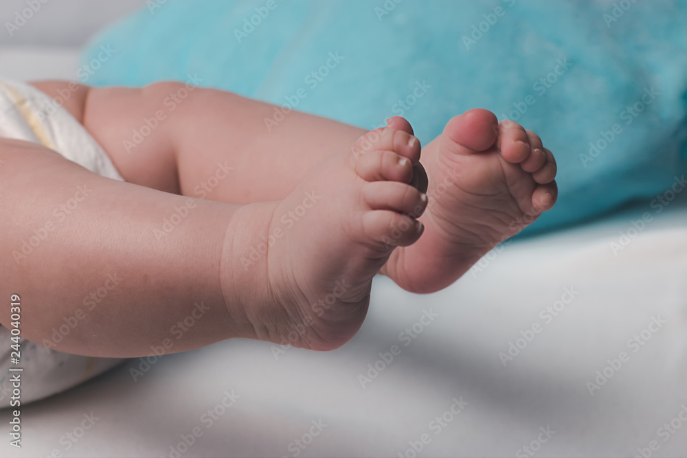 Cute plump legs of a newborn baby Cute plump legs of a newborn baby