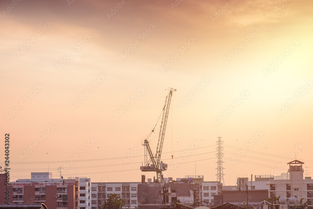 Construction site with cranes against