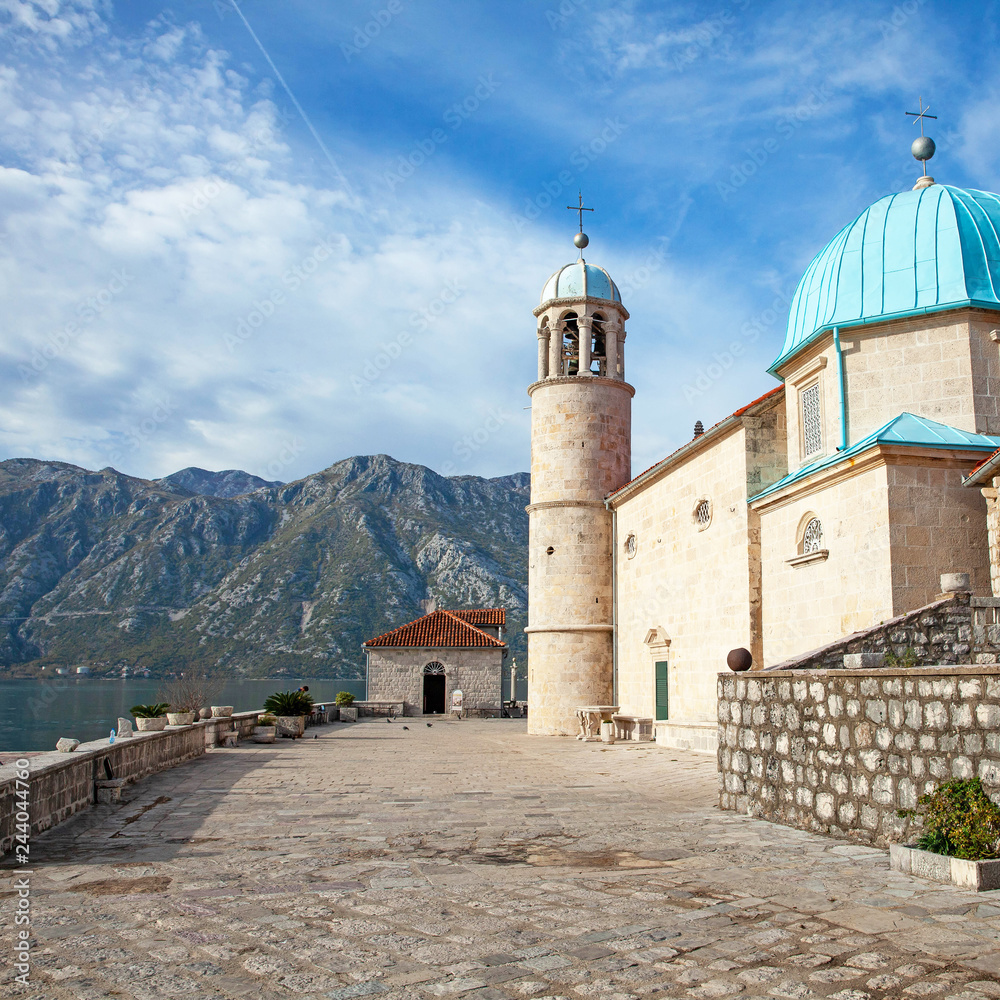 stone ancient christian monastery with a turquoise roof