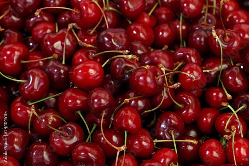 Fresh red cherries on retail market close up