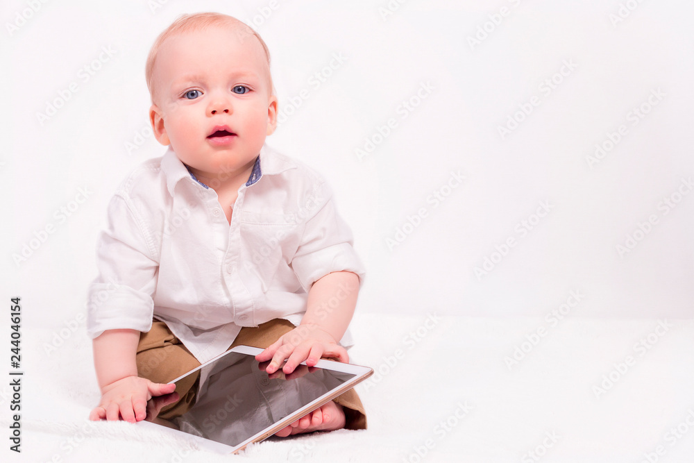 little boy with touch pad, early learning. Copy space little boy with touch pad, early learning. Copy space