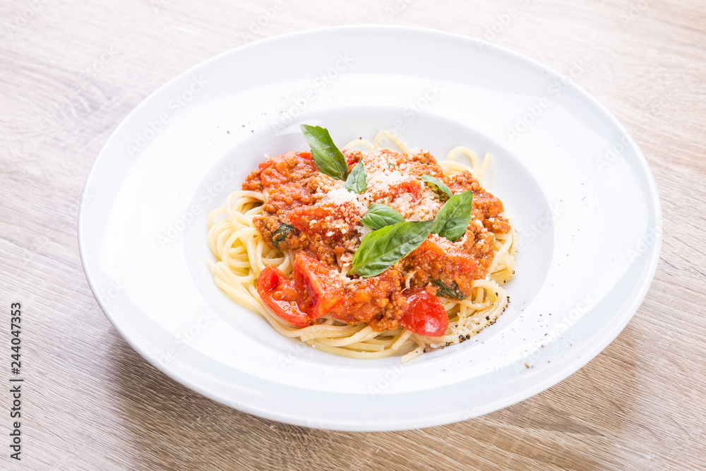 spaghetti bolognese with veal and basil leaves spaghetti bolognese with veal and basil leaves
