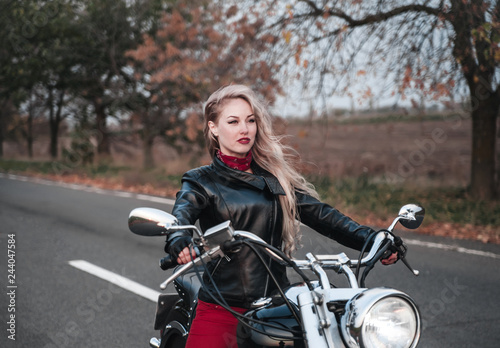 Beautiful woman with motorcycle outdoors. © Alona