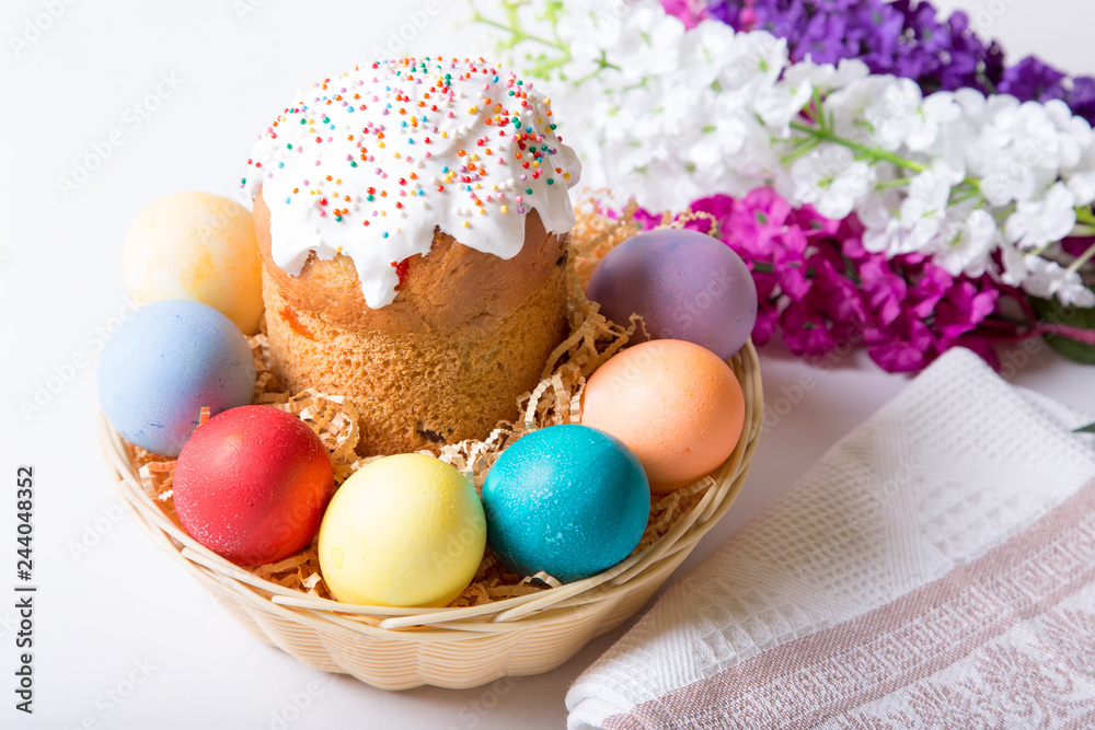 Fototapeta premium Easter. Traditional Russian and Ukrainian Easter cake (kulich) and painted eggs. Close-up, selective focus.