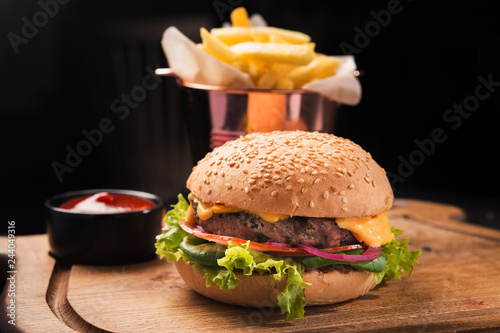 classic burger on a wooden board
