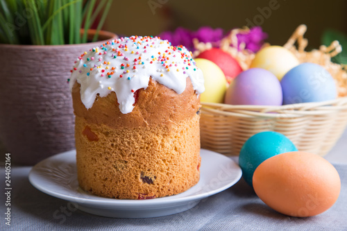 Easter. Traditional Russian and Ukrainian Easter cake (kulich) and painted eggs. Close-up, selective focus. photo