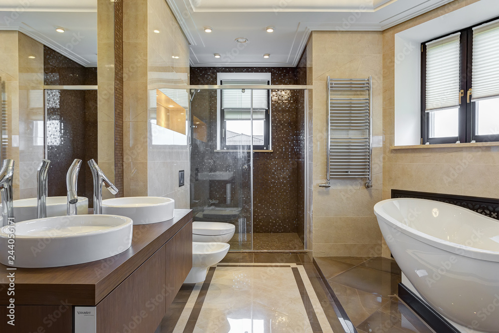 Bathroom with ceramic bath under window.